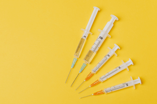 spore syringes on a yellow background